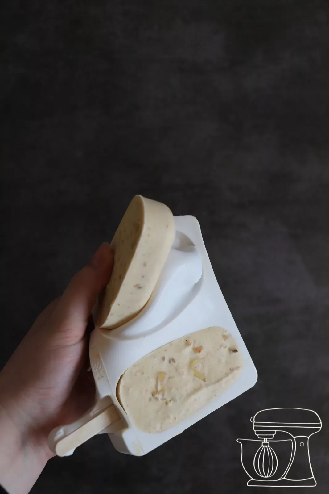 Frozen cakesicle being released from the mould