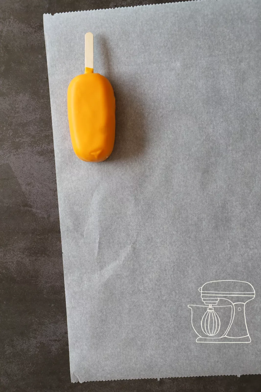 Glazed cakesicles on baking paper
