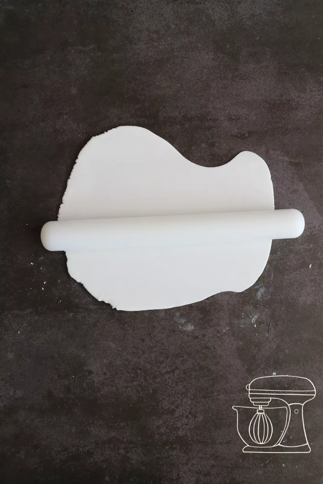 White Fondant being cut into strips