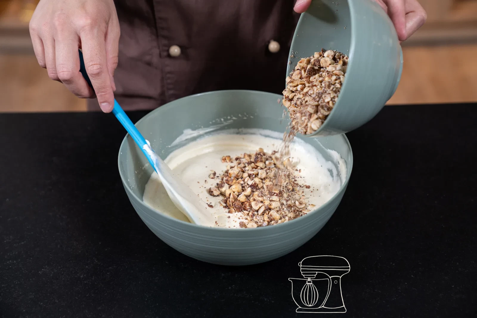 Chopped hazelnuts being added to the parfait mixture