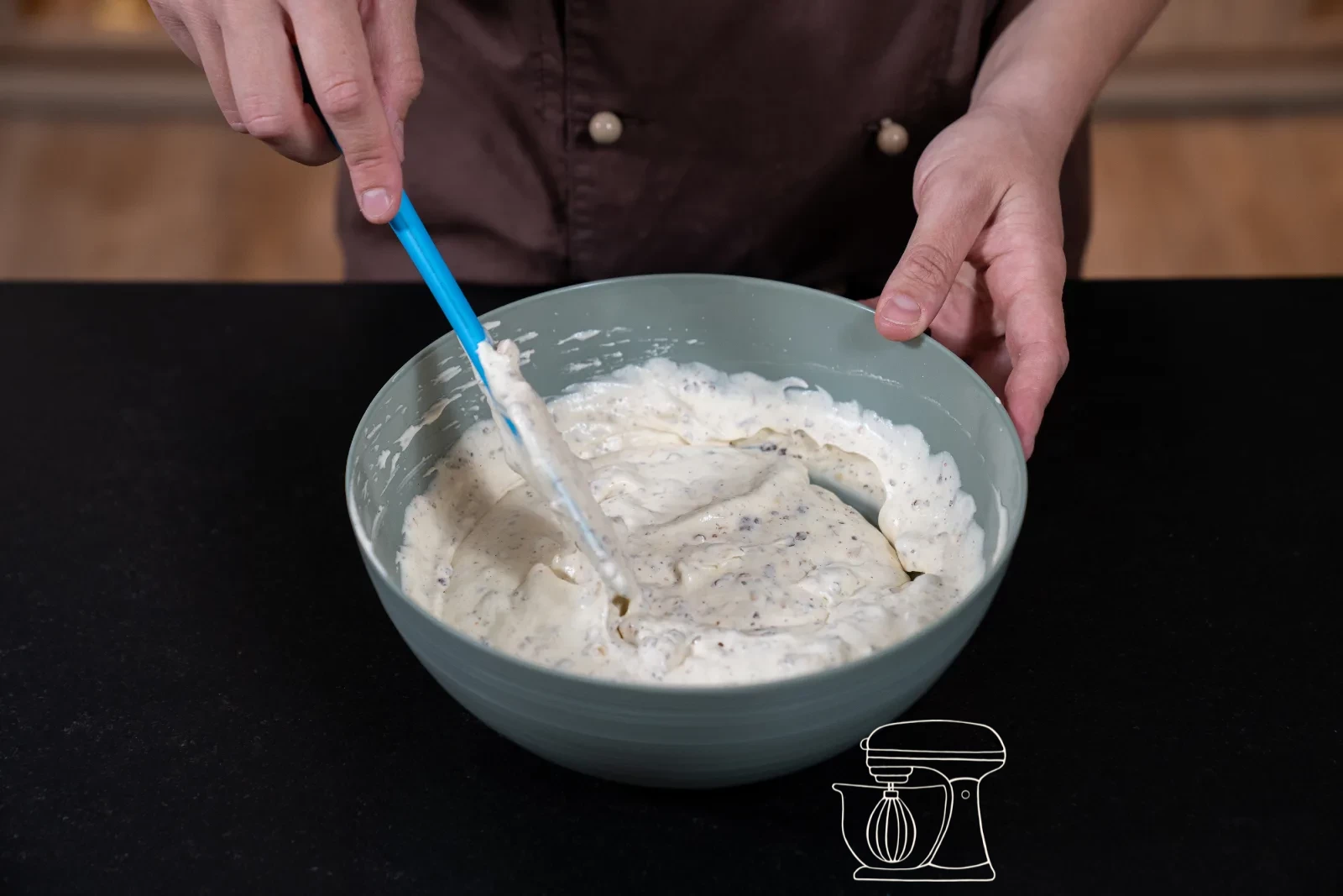 Hazelnuts being folded evenly into the parfait mixture