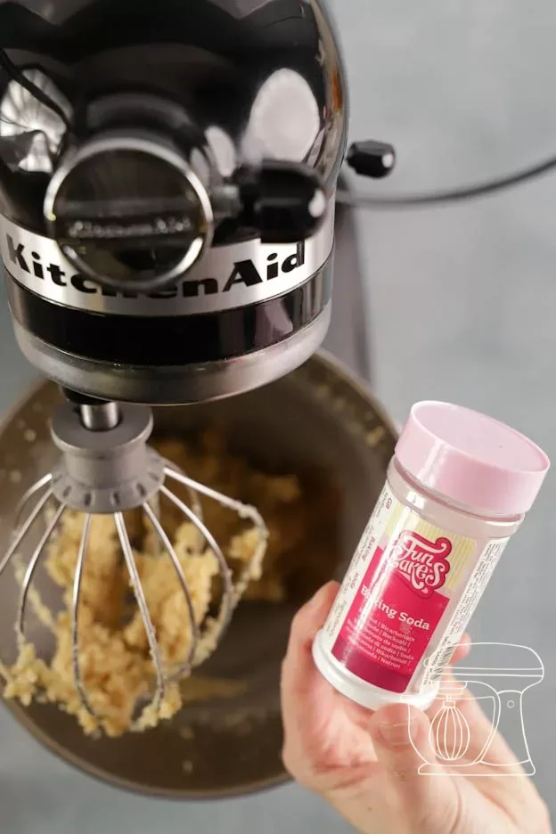 Baking soda is added with the measuring spoon