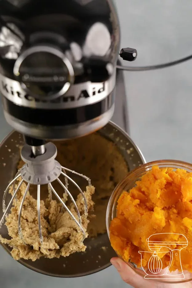 Pumpkin purée is stirred in with the whisk