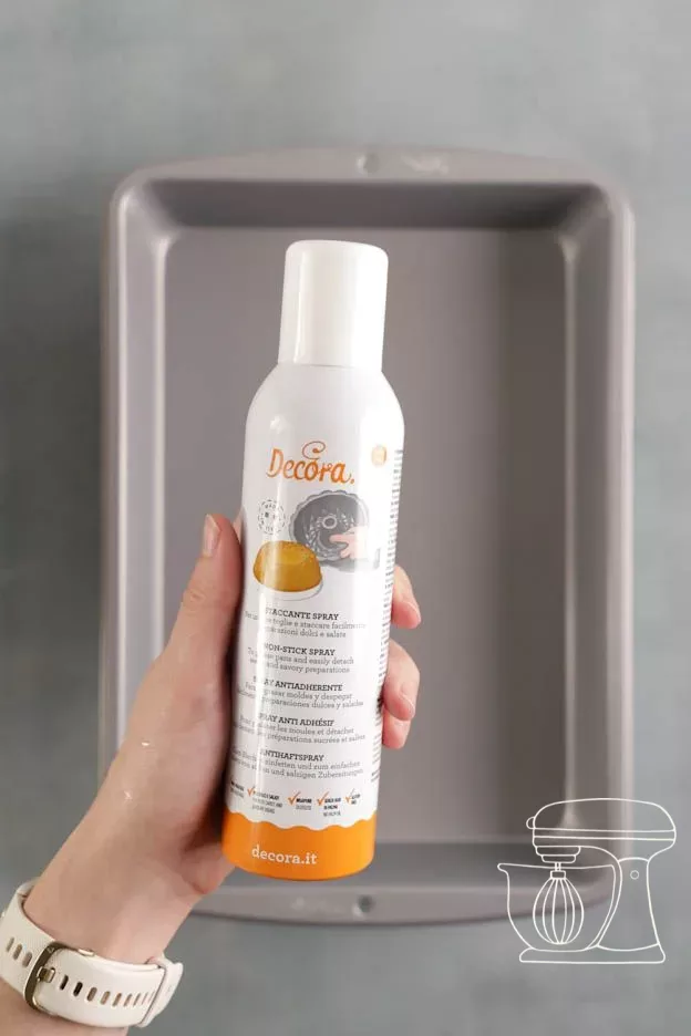 Tin being sprayed with Non-stick spray