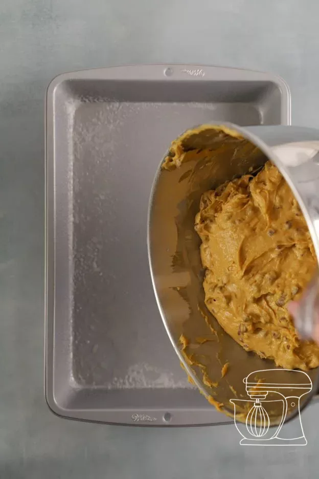Brownie batter being poured into the tin