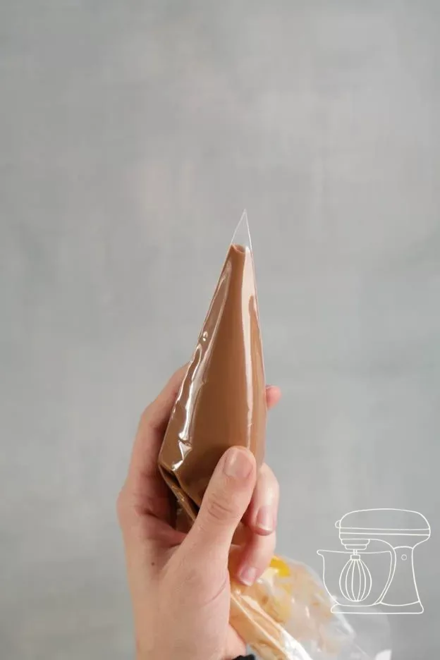 Chocolate being filled into a small Piping bag