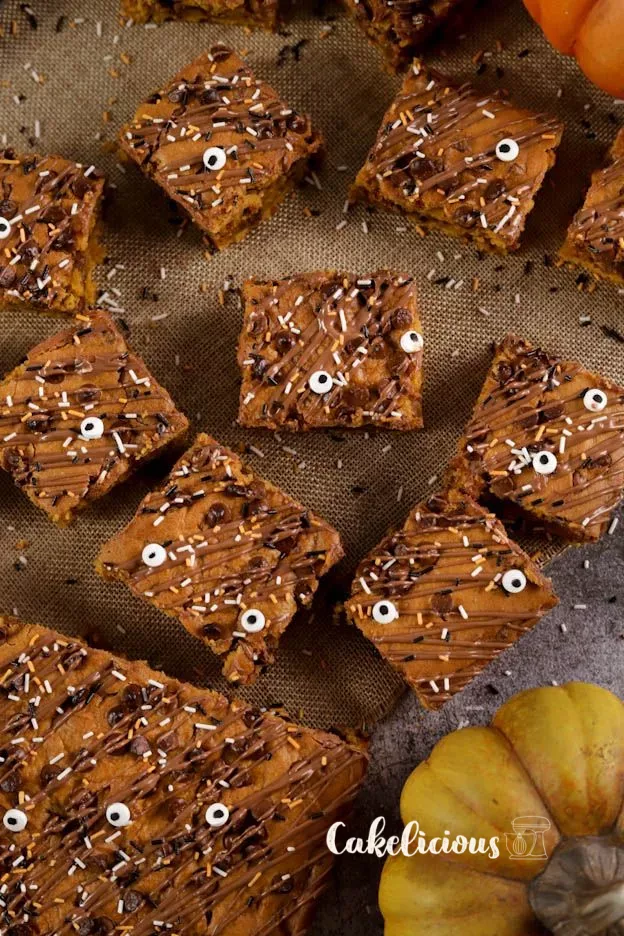 Moist pumpkin brownies with chocolate chips and Halloween decoration