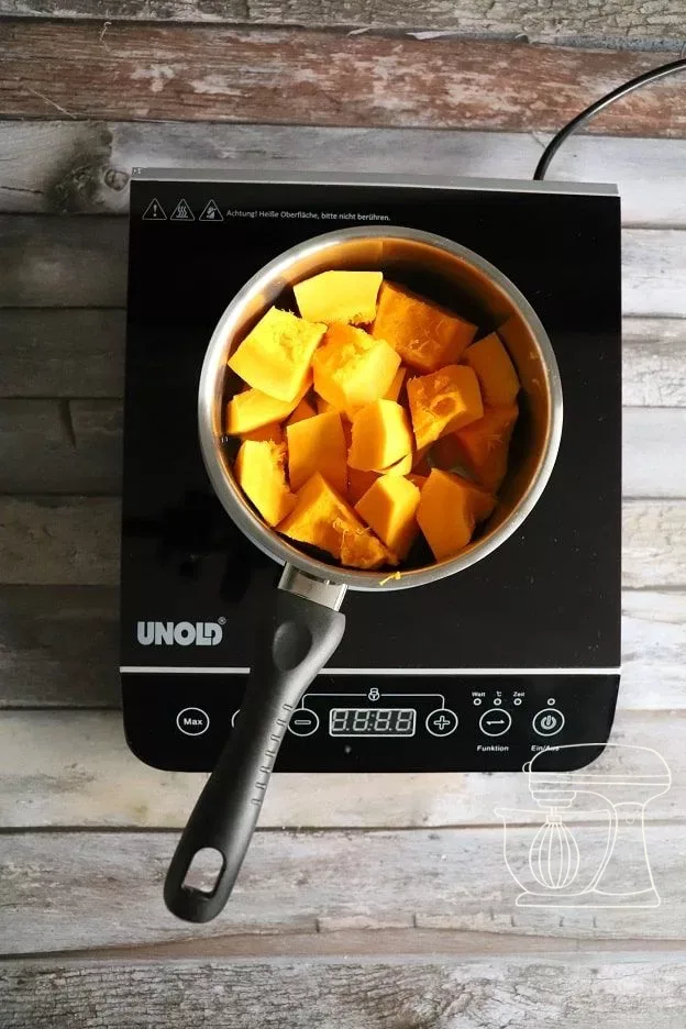 Squash pieces cooking in a large pot