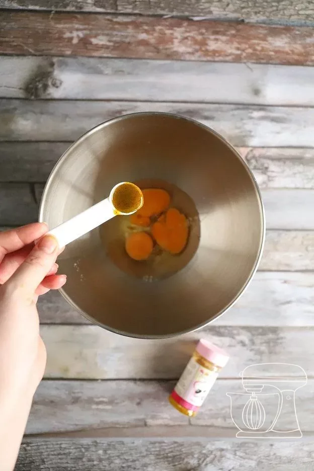 Sugar is sprinkled in while stirring