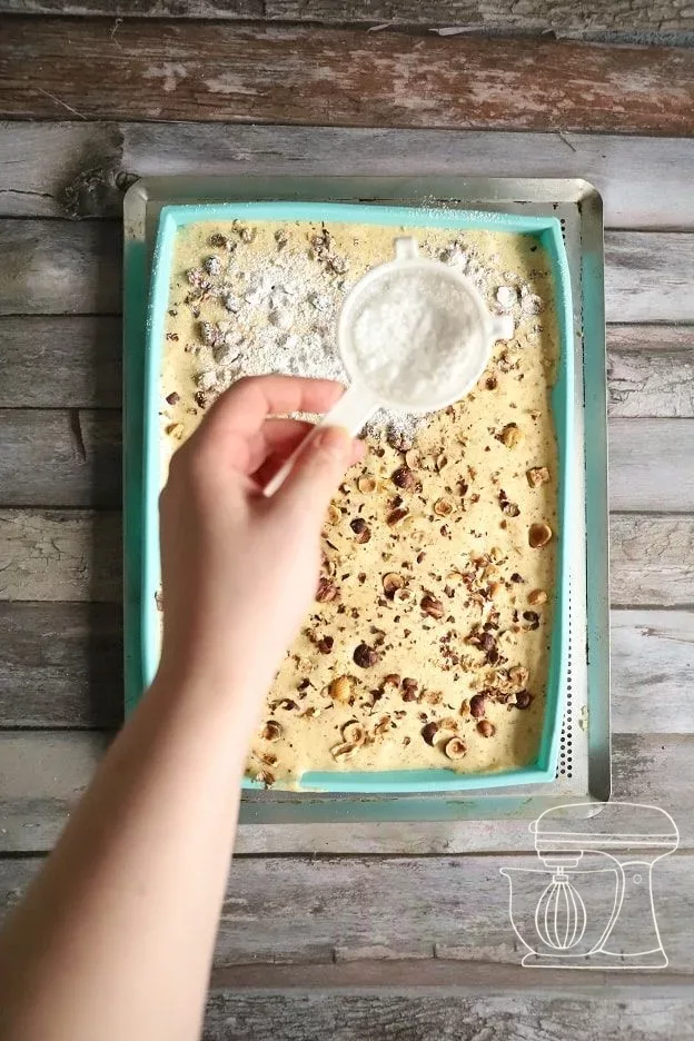 Hazelnut sponge on the perforated tray in the oven