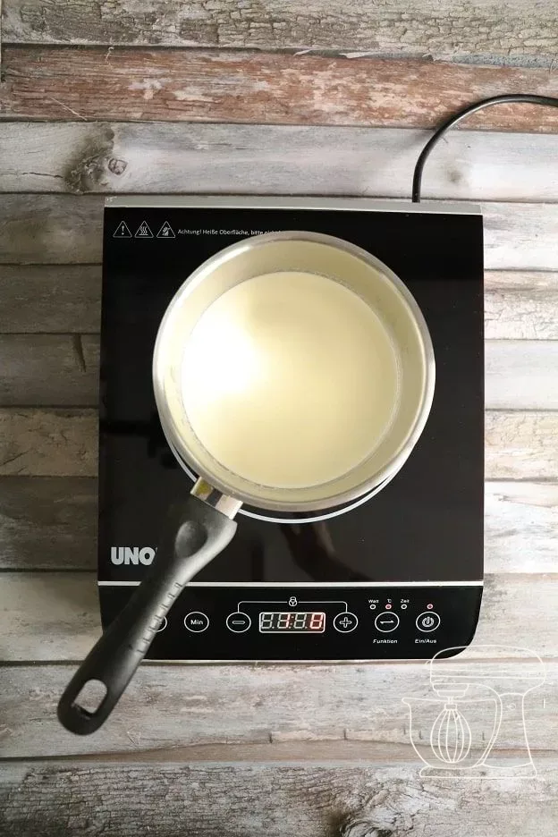 Full cream being brought to the boil in a pot