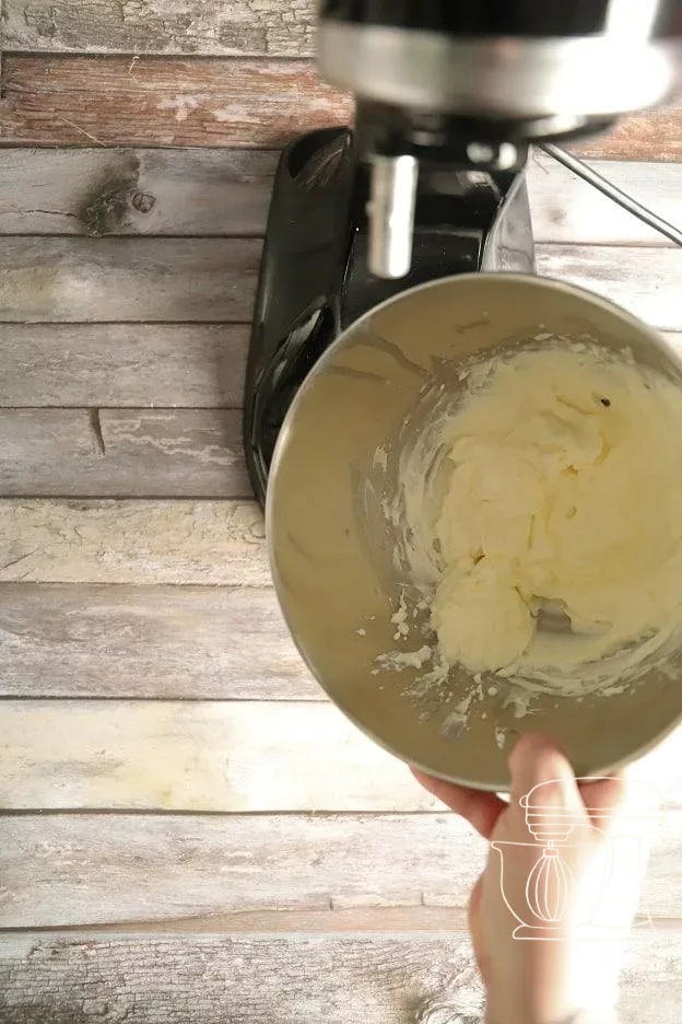 Full cream being whipped with icing sugar