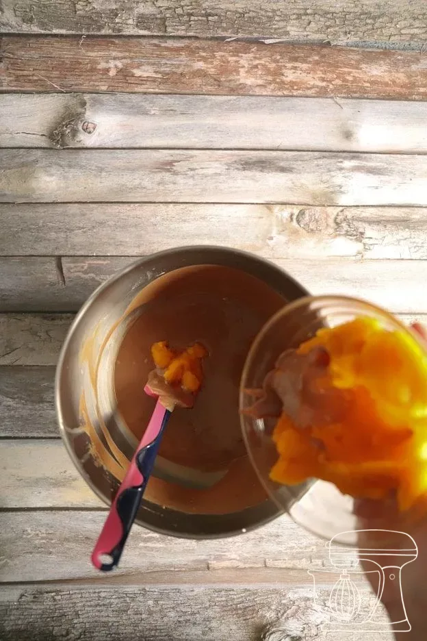 Pumpkin purée being added to the chocolate mousse