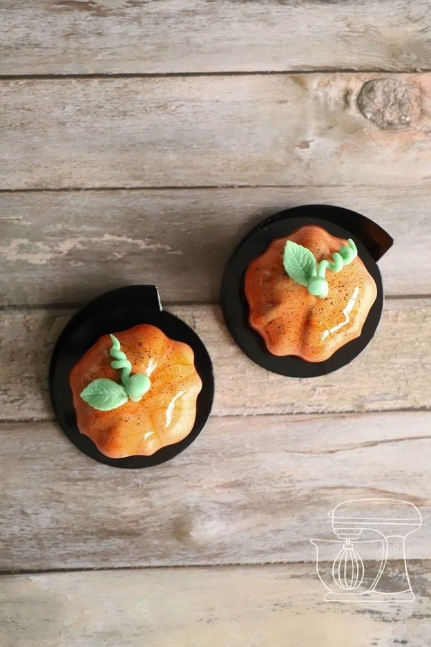 Leaves are placed on the glazed pumpkin