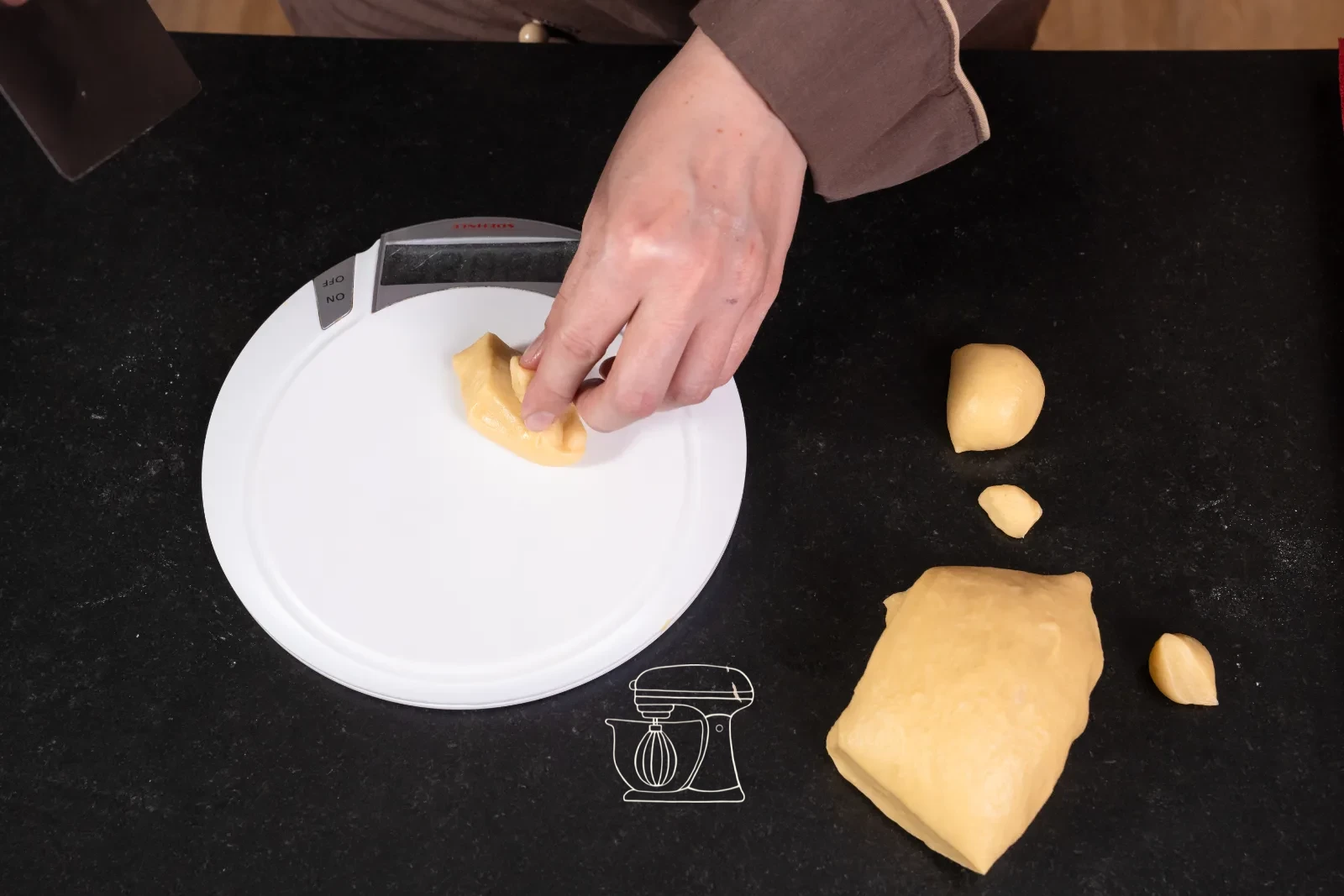 Mini salmon roll – Brioche with horseradish cream and smoked salmon – weigh the dough and shape into balls