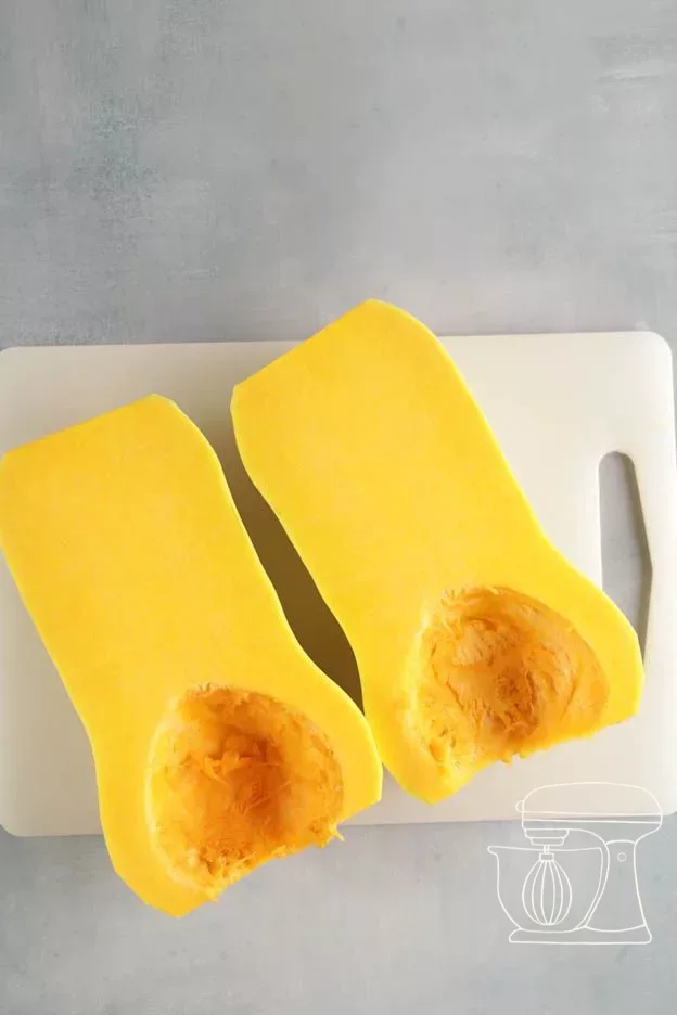 Pumpkin being cut into cubes of 3 to 4 cm