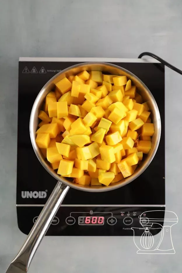 Pumpkin cooking covered over medium heat