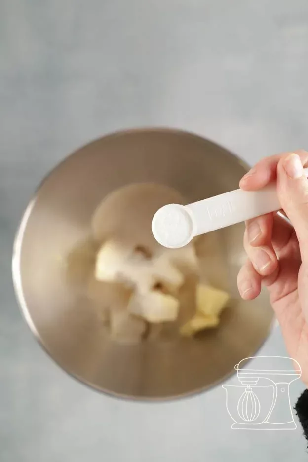 Salt being added with the Measuring spoon