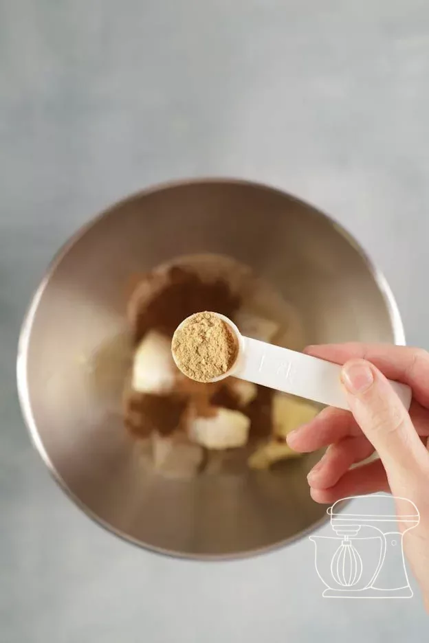 Ground ginger being added to the mixture