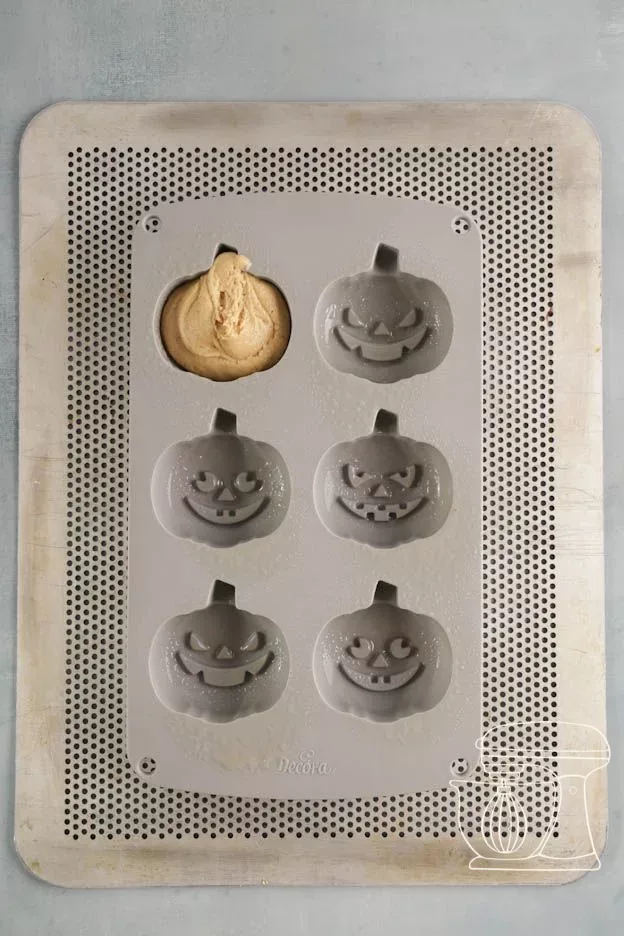 Dough is piped into the pumpkin silicone mold