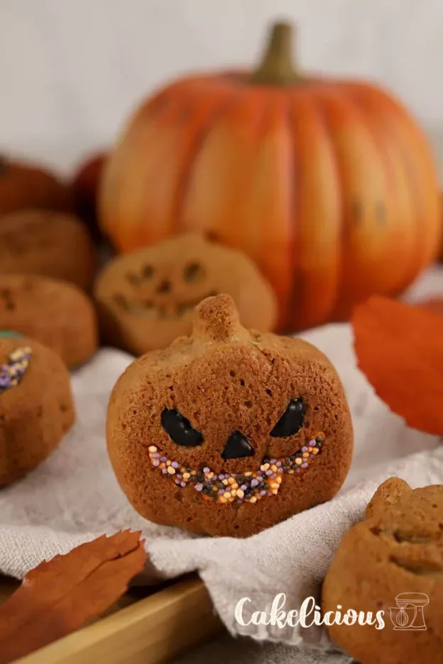 Mini pumpkin cakes with maple Syrup, colourfully decorated with Chocolate flavour pens