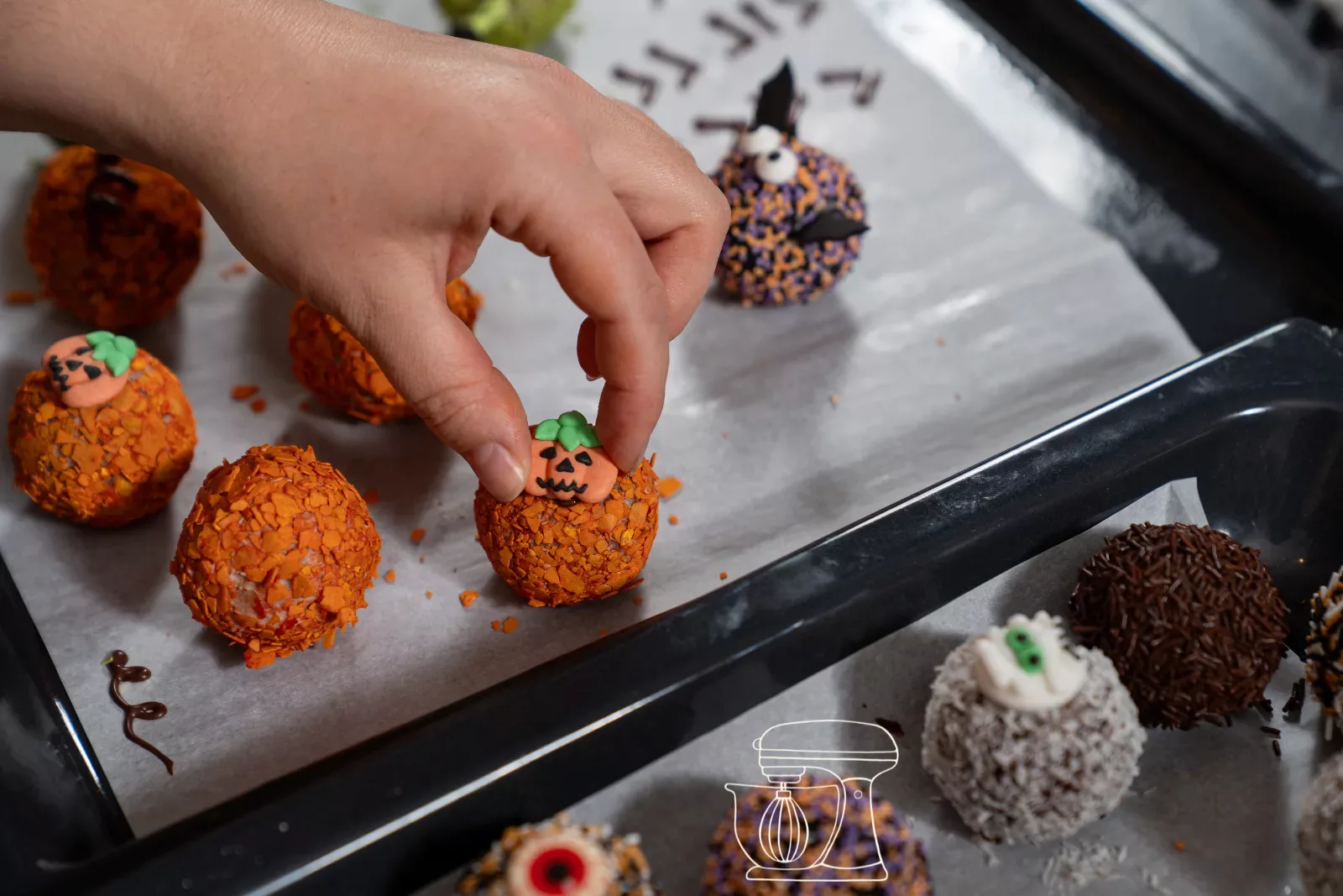 Place sugar decoration on the orange pumpkin balls