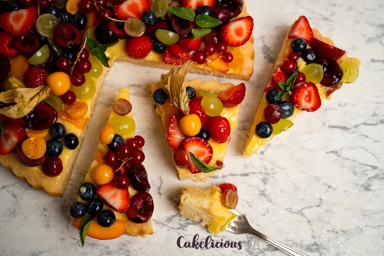 Sliced fruit cake with custard cream, airy base visible in detail
