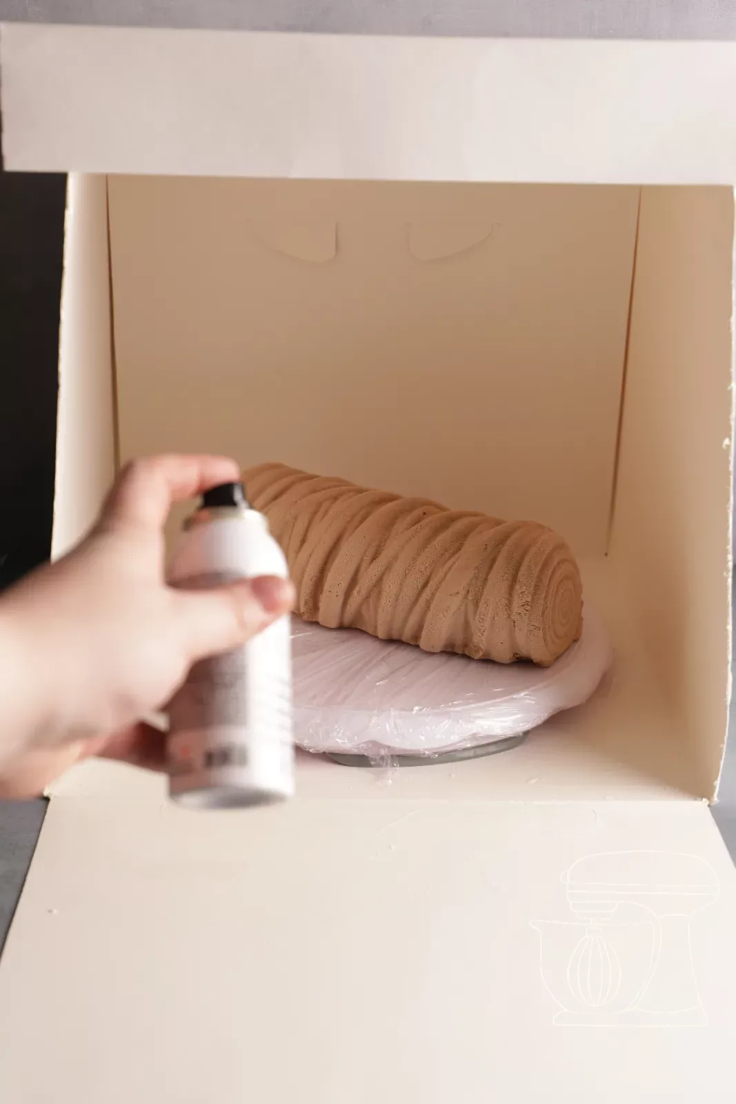 Spruzzare la bûche con lo spray velluto