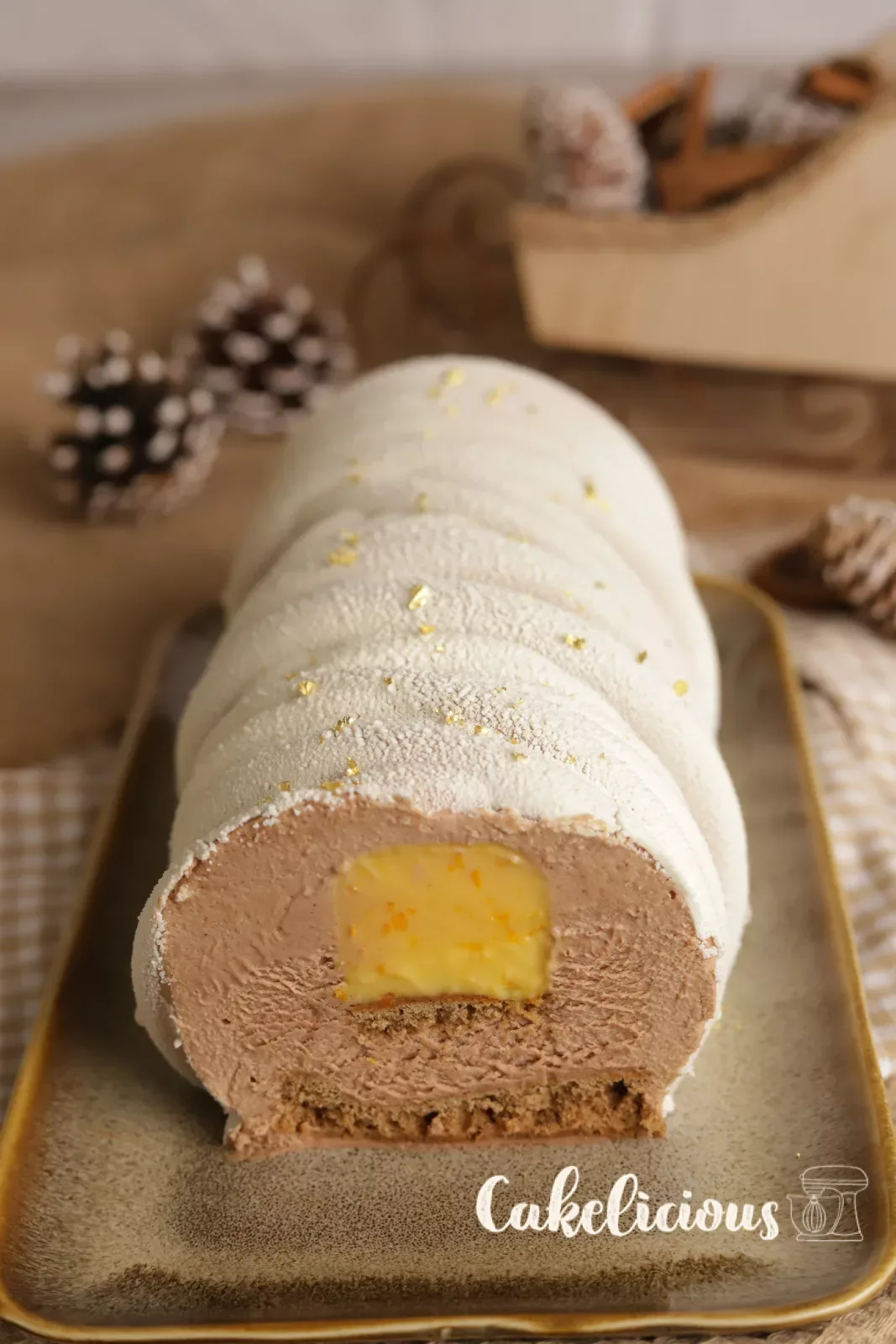 Bûche tagliata con crema all'arancia e mousse al cioccolato al latte