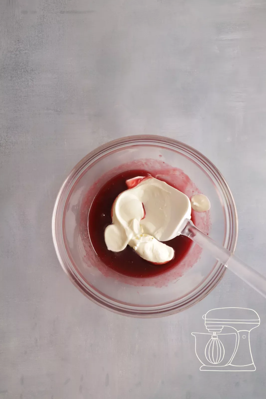Adding the cream to the raspberry purée