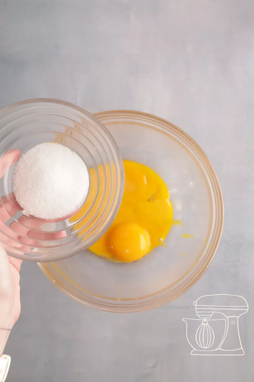 Adding sugar to the egg yolks