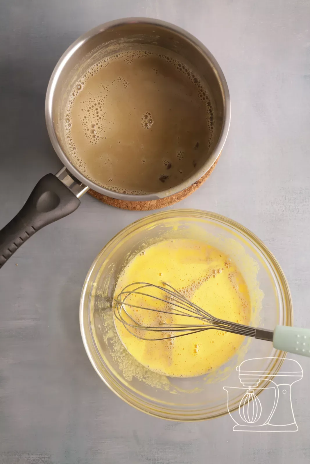 Pouring milk over the egg yolks