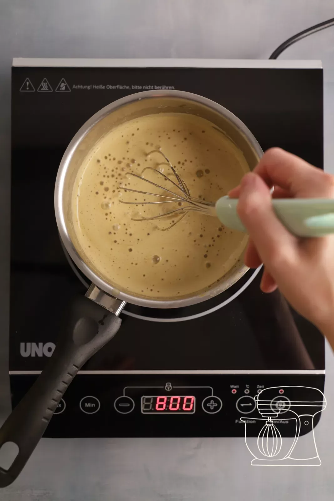 Heating the custard in the saucepan