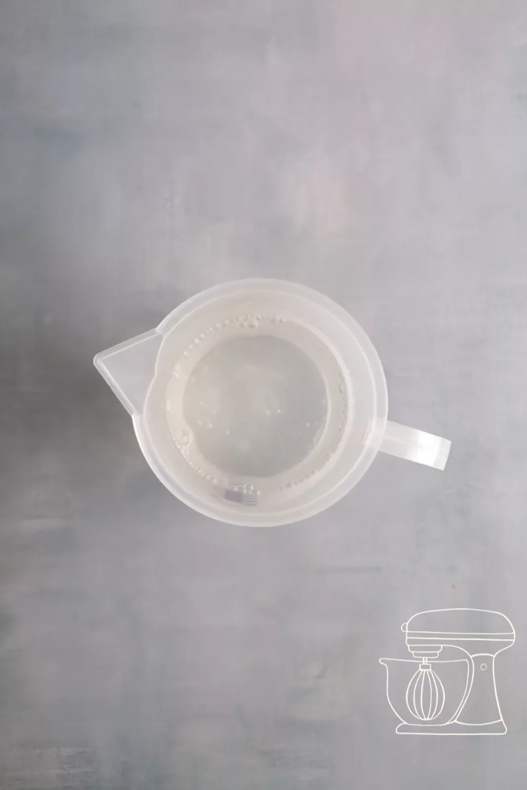 Measuring cup with hot water