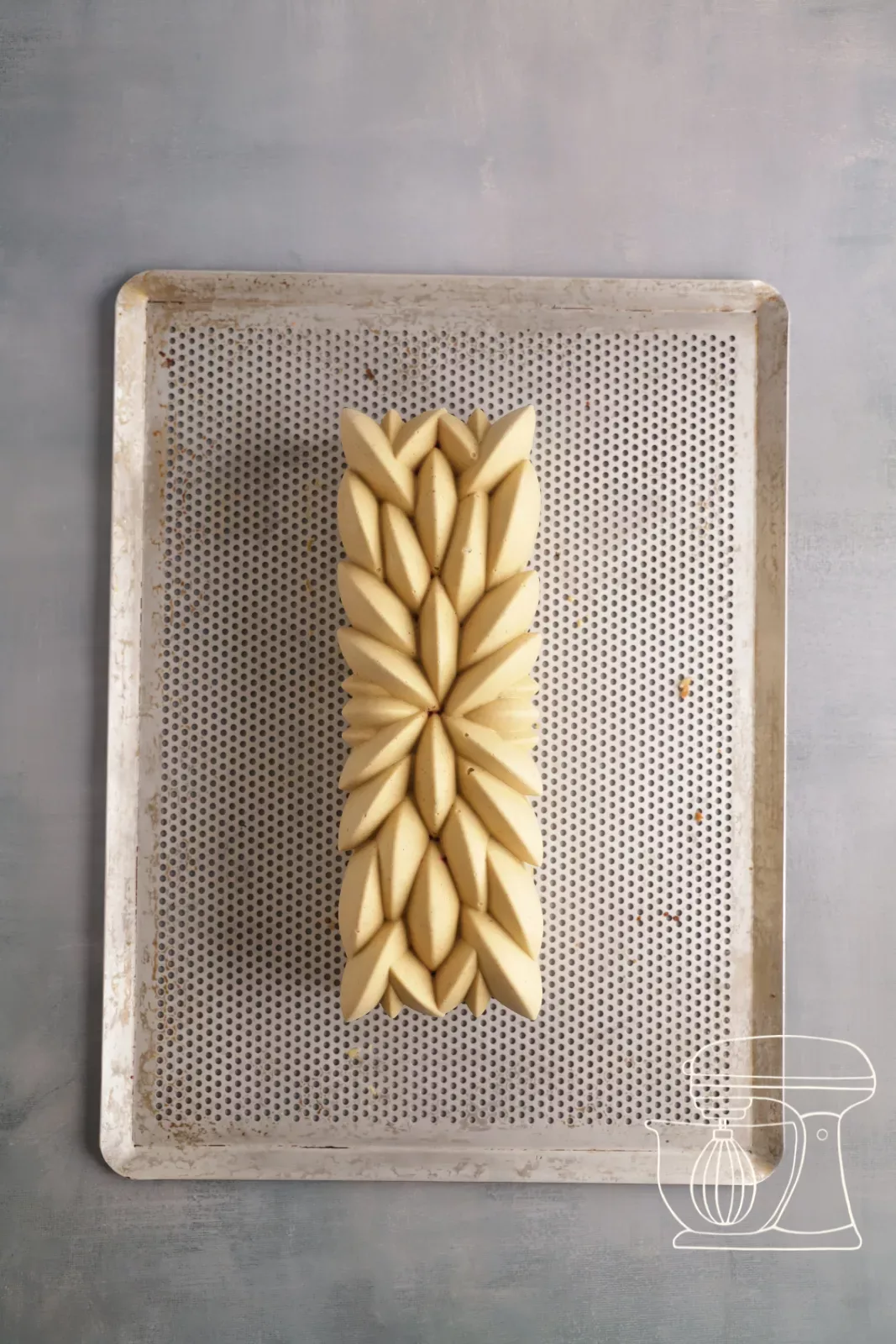Released bûche on the perforated baking sheet