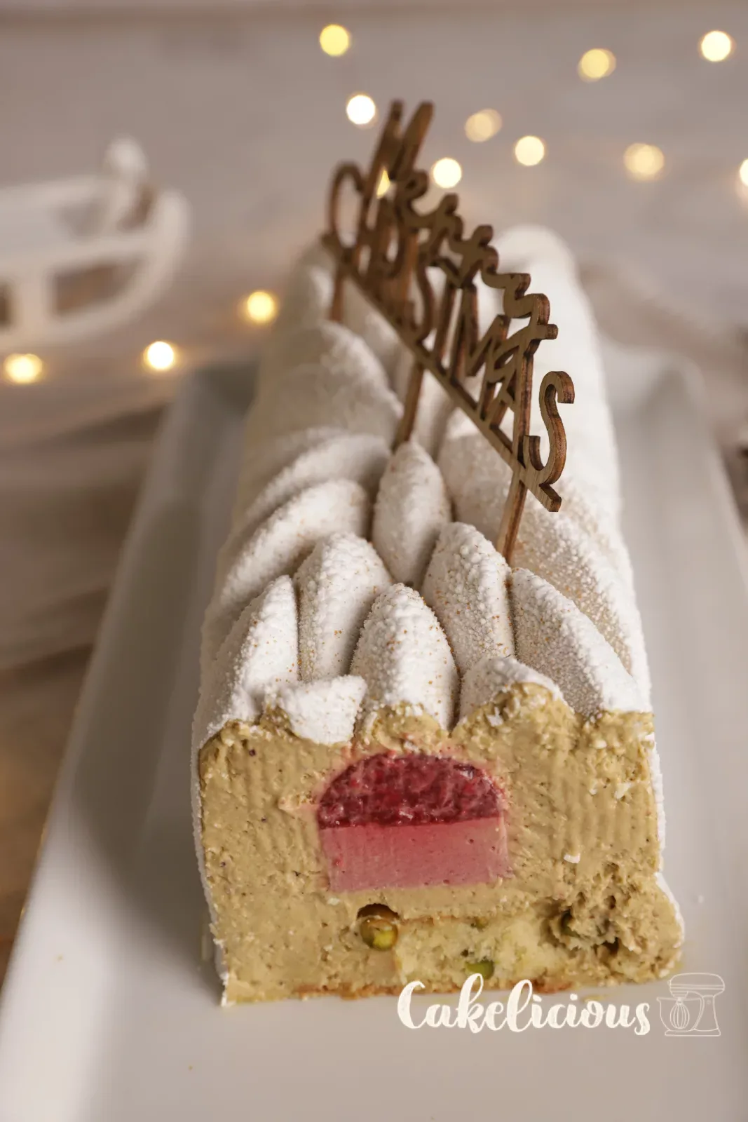 Sliced buche with raspberry insert and pistachio bavarois