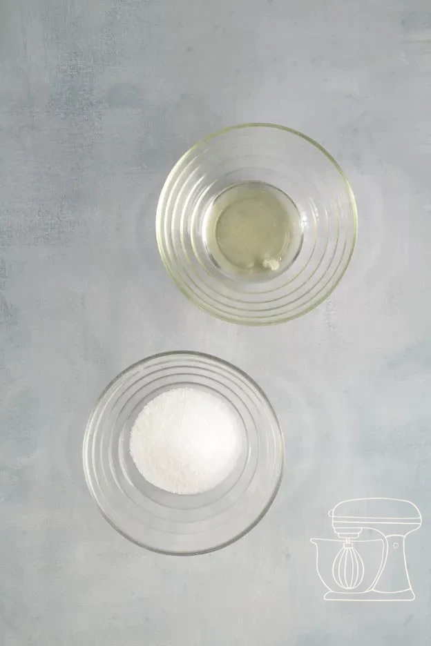 Egg white being whipped to a foam in a mixing bowl with a hand mixer