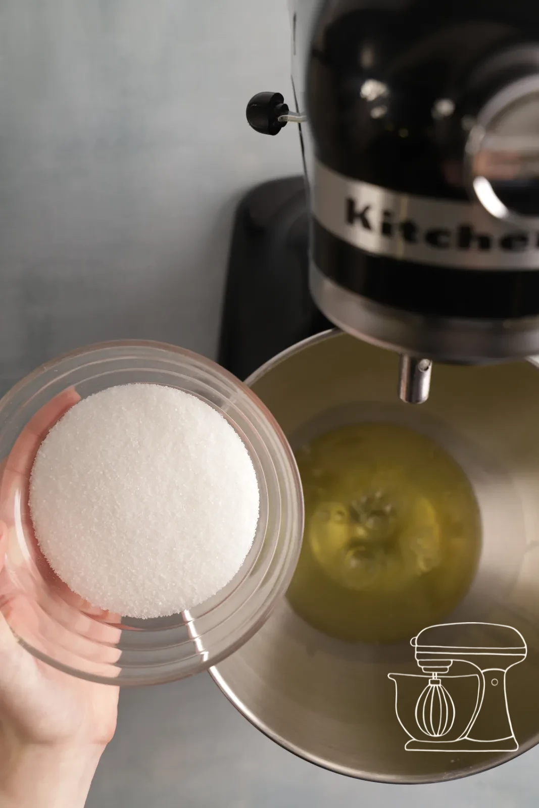 Egg white being whipped stiff with sugar