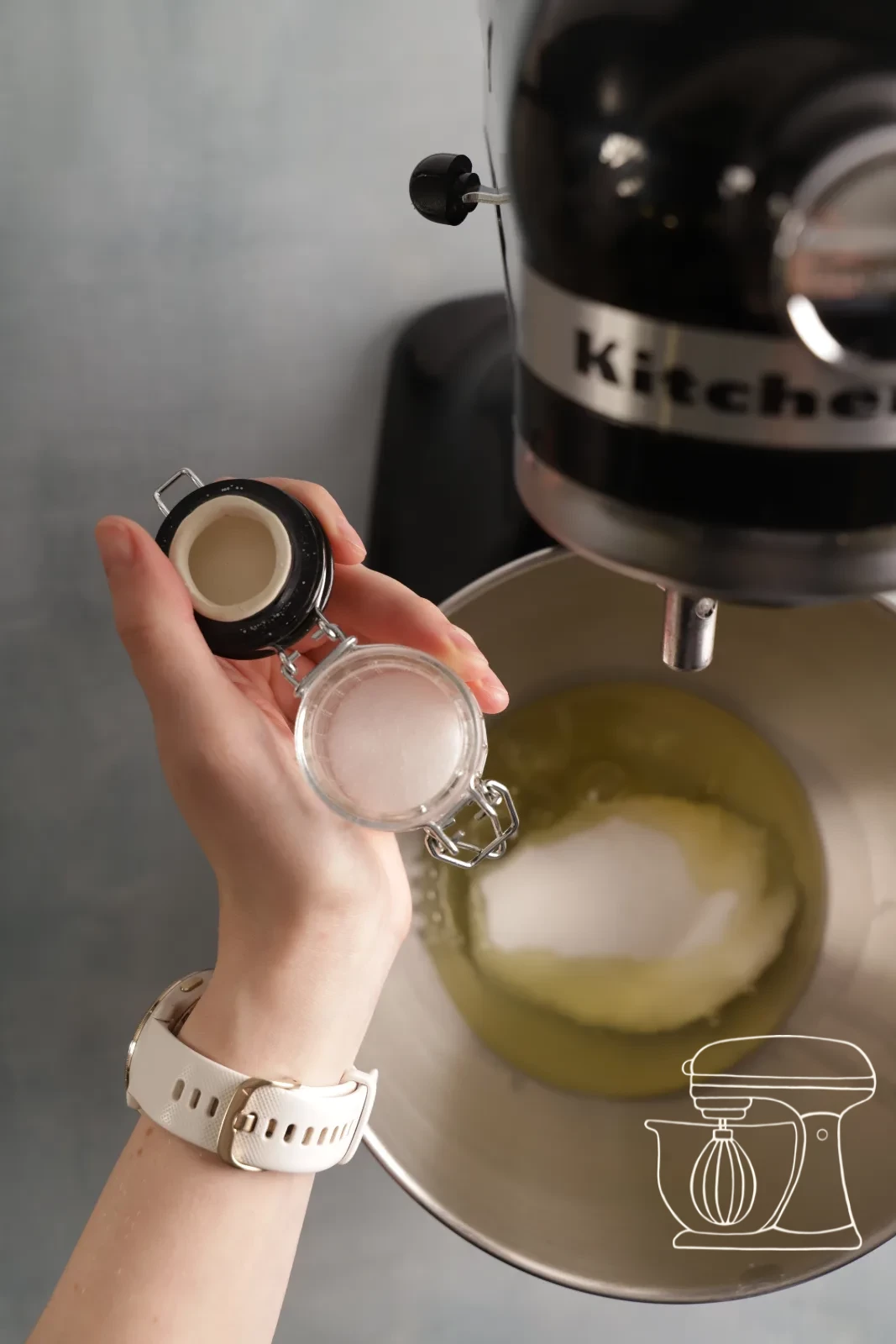 Egg white being whipped stiff with salt