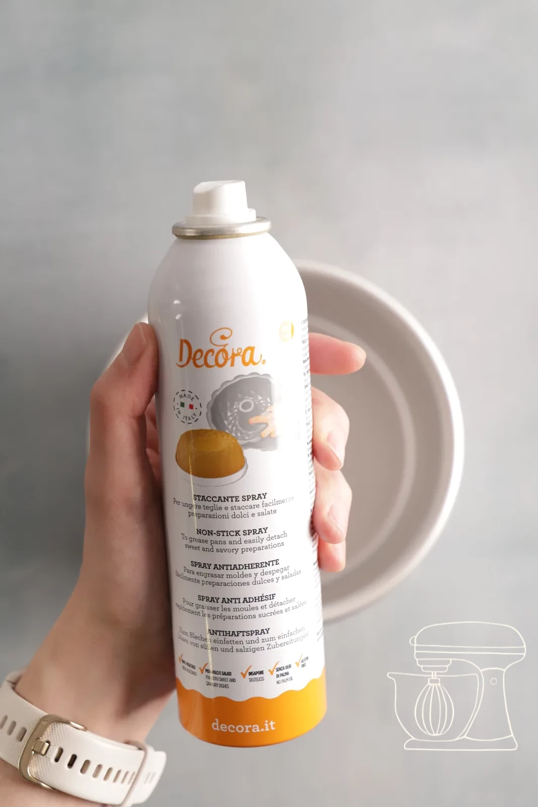 Baking tin being sprayed with non-stick spray