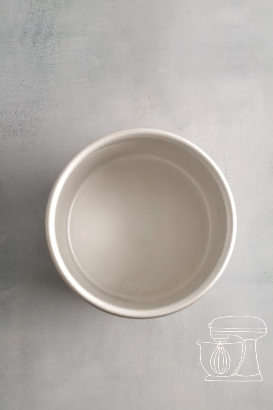 Baking tin being sprayed with non-stick spray