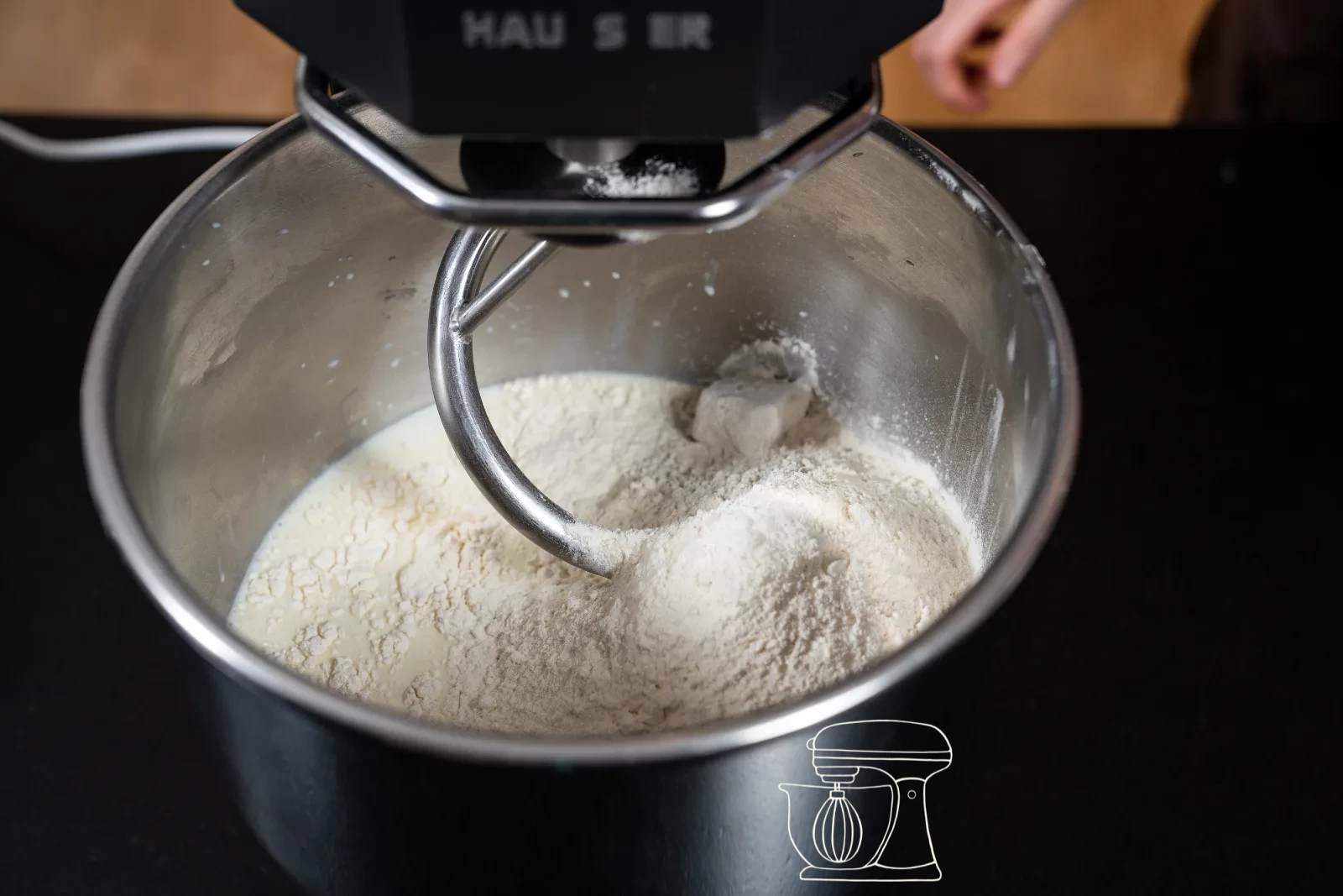 After three minutes a coarse dough mass has formed