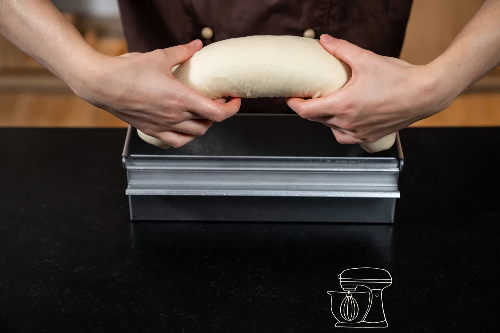 The shaped dough is placed into the prepared tin