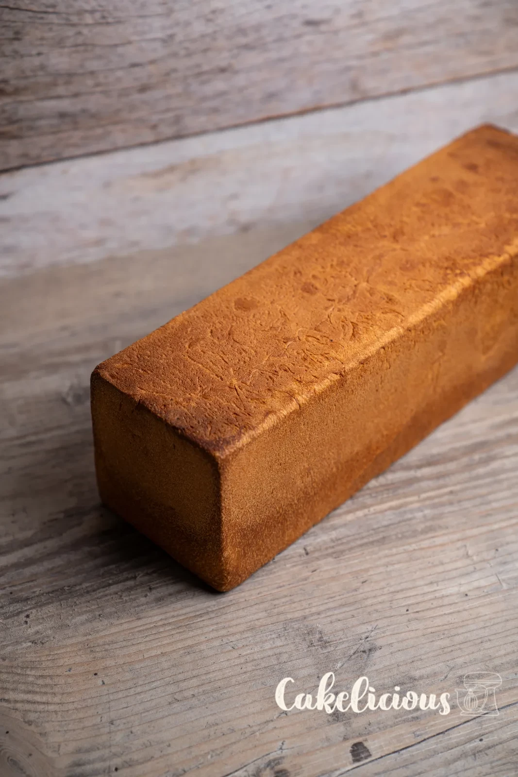 Sliced toast bread on a wooden board with a bread knife