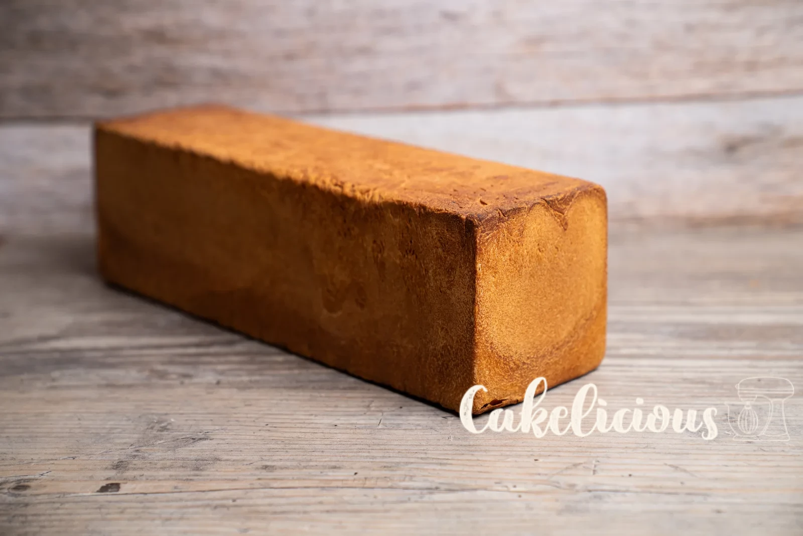 Sliced toast bread on a wooden board with a bread knife