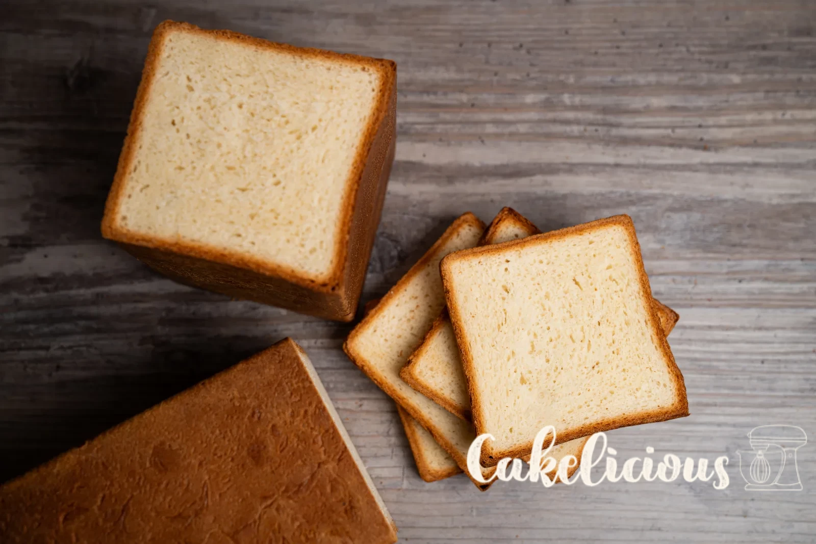 Sliced toast bread on a wooden board with a bread knife